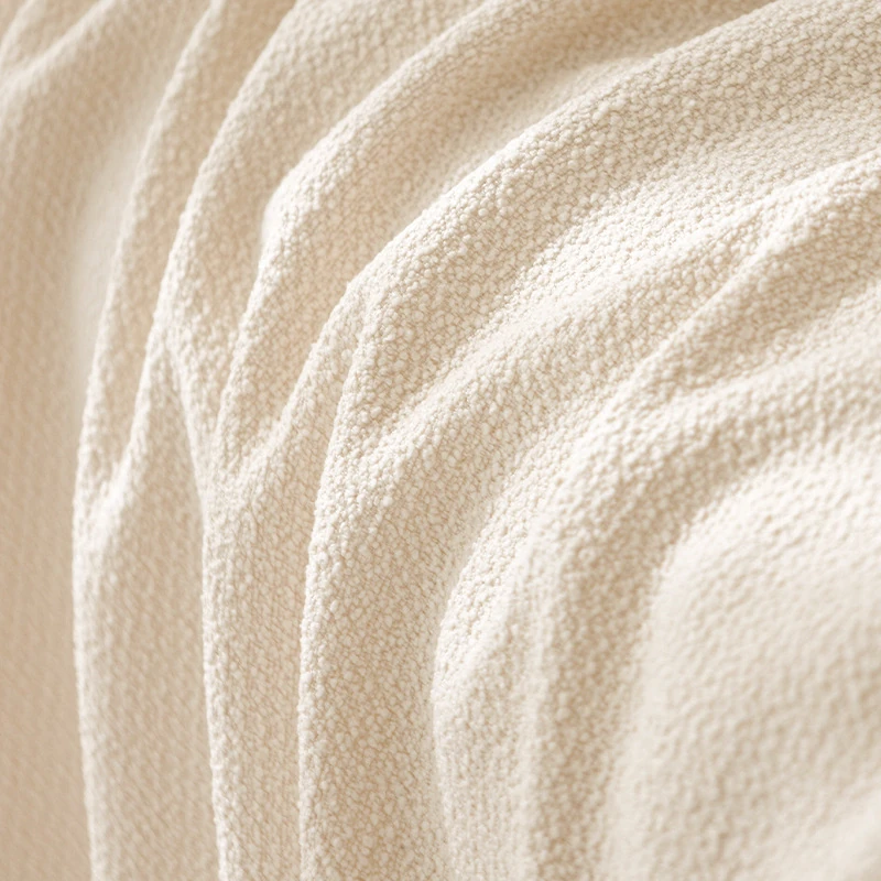 Soft cream Teddy velvet fabric with gentle folds, showcasing a plush, textured surface in a minimalist, calm aesthetic — ideal for scratch resistant fabric in pet-friendly homes.