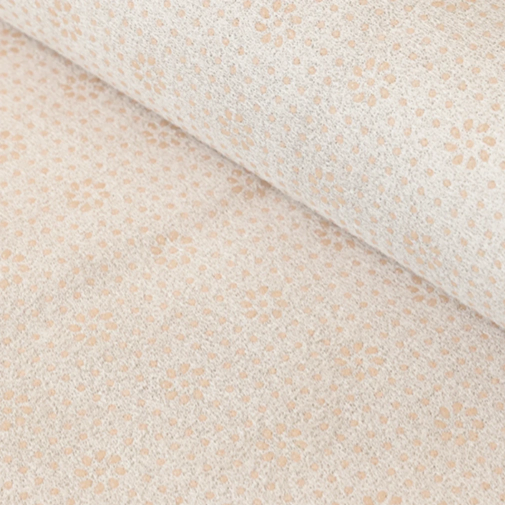 Soft beige fabric with a delicate speckled texture, featuring subtle warm tones and a tactile, cloud-like surface ideal for harmonious pet living.