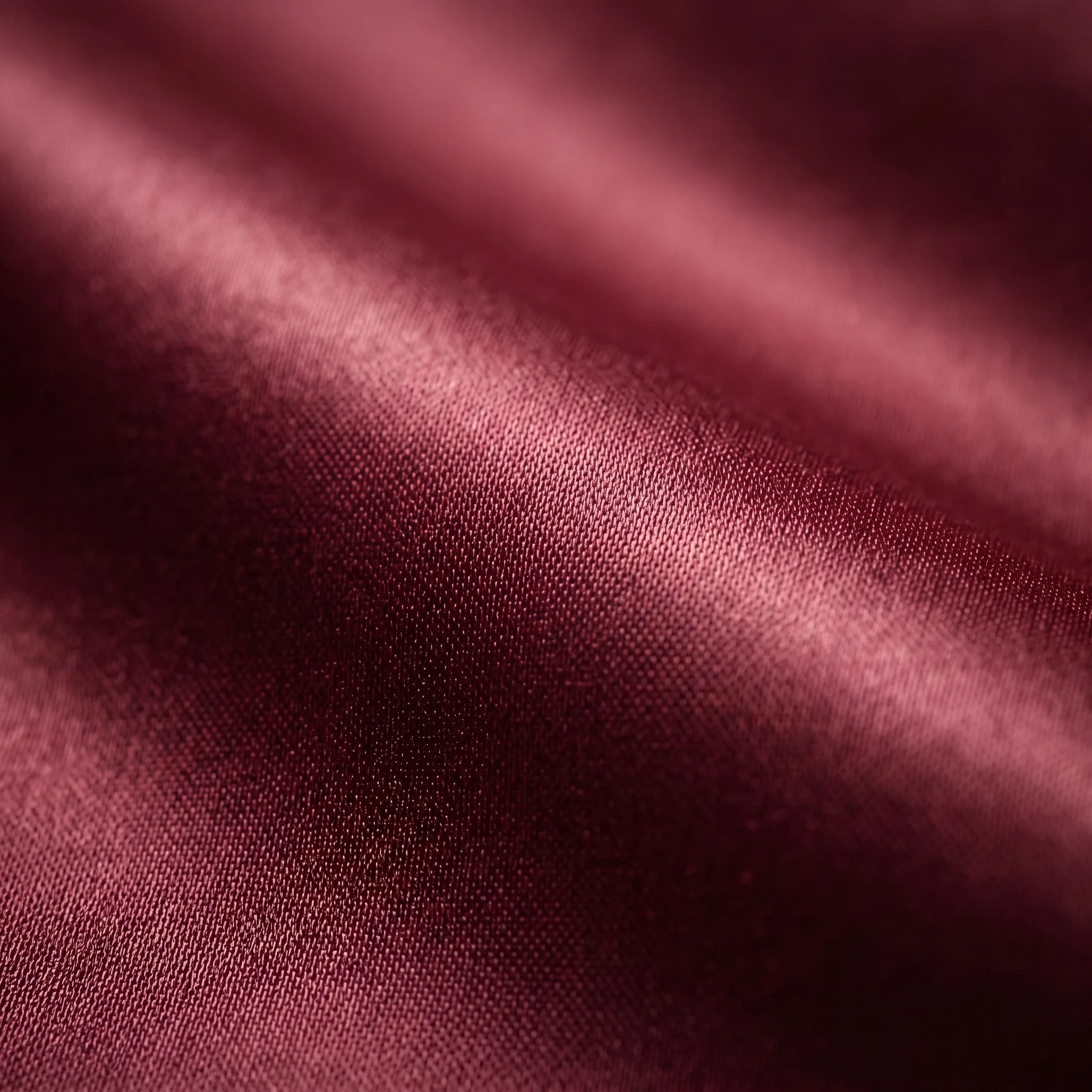 Rich burgundy fabric texture of NookPaws Doberman Varsity Jacket, showcasing soft weave and subtle sheen under warm lighting for deep-chested large breeds.